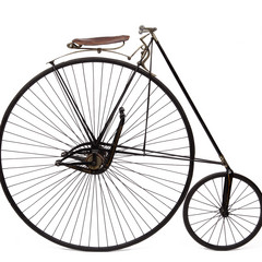 Bicycle from the Museum's collection with an abnormally large back wheel.